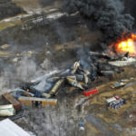 
              This photo taken with a drone shows portions of a Norfolk and Southern freight train that derailed Friday night in East Palestine, Ohio are still on fire at mid-day Saturday, Feb. 4, 2023. (AP Photo/Gene J. Puskar)
            