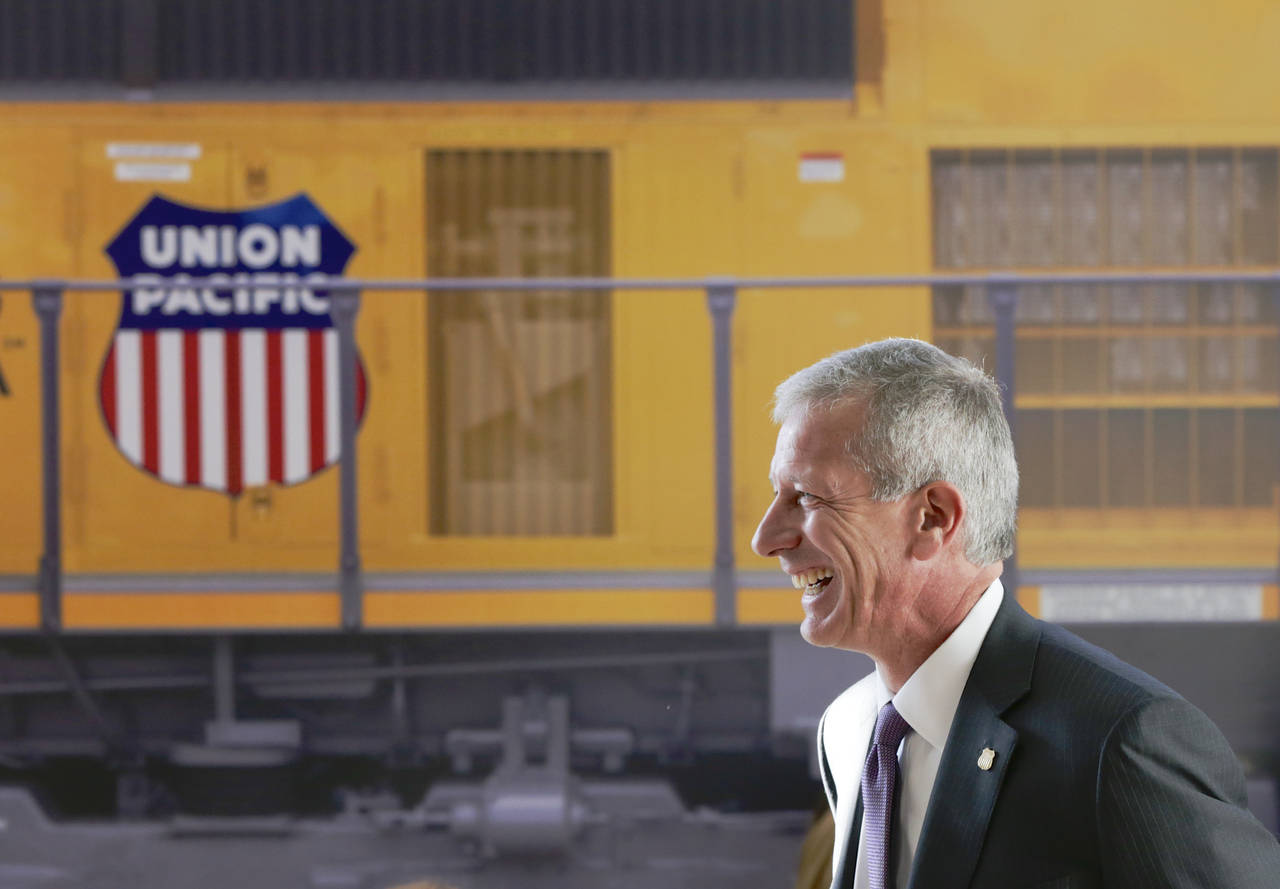 FILE- Union Pacific Chairman, President, and CEO Lance Fritz smiles after a news conference at the ...