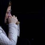 
              A woman mourns the Turkish Cypriot victims of the earthquake in Turkey, during a funeral procession in the Turkish occupied area in northeast coastal city of Famagusta, Cyprus, on Friday, Feb. 10, 2023. A funeral service was held in Famagusta city for Fahri Arkar, Mert Niyazi Topukcuoglu and brothers Doruk and Alp Akin, who perished in the ruins of their collapsed hotel in the Turkish city of Adiyaman. (AP Photo/Petros Karadjias)
            