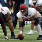 
              National offensive lineman Jake  Andrews of Troy (77) runs drills during practice for the Senior Bowl NCAA college football game Thursday, Feb. 2, 2023, in Mobile, Ala.. (AP Photo/Butch Dill)
            