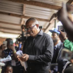 
              Nigeria's Labour Party's candidate Peter Obi casts his vote during the presidential elections in Agulu, Nigeria, Saturday, Feb. 25, 2023. Voters in Africa's most populous nation are heading to the polls Saturday to choose a new president, following the second and final term of incumbent Muhammadu Buhari. (AP Photo/Mosa'ab Elshamy)
            