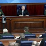 
              Russian President Vladimir Putin, center, speaks as Defense Minister Sergei Shoigu, left, and Chief of the General Staff Gen. Valery Gerasimov attend a meeting with senior military officers in Moscow, Russia, on Wednesday, Dec. 21, 2022. Putin sent Russian forces into Ukraine on Feb. 24, 2022, and appears determined to prevail. (Sergey Fadeichev, Sputnik, Kremlin Pool Photo via AP, File)
            