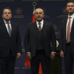 
              Turkey's Foreign Minister Mevlut Cavusoglu, centre, European Commissioner for Neighbourhood and Enlargement Oliver Varhelyi, left, and Sweden's Minister for International Development Cooperation and Foreign Trade Johan Forssell stand at the end of a joint news conference in Ankara, Turkey, Wednesday, Feb. 22, 2023. Varhelyi and Forssell are in town to prepare for the International Donor's Conference, scheduled for March in Brussels, and aimed at mobilizing funds from the international community to support Turkey and Syria following the quakes.(AP Photo/Burhan Ozbilici)
            