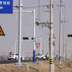 
              Police officers stand at a checkpoint along a road leading to the site of a collapsed open pit mine in Alxa League in northern China's Inner Mongolia Autonomous Region, Thursday, Feb. 23, 2023. An open pit mine collapsed in China's northern Inner Mongolia region on Wednesday, killing multiple people and leaving dozens more missing, state media reported. (AP Photo/Ng Han Guan)
            