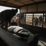 
              People prepare to bury their loved ones, victims of Monday earthquake, in Adiyaman, Turkey, Friday, Feb. 10, 2023. Emergency crews made a series of dramatic rescues in Turkey on Friday, pulling several people, some almost unscathed, from the rubble, four days after a catastrophic earthquake killed more than 20,000.(AP Photo/Emrah Gurel)
            