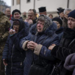 
              Relatives react as soldiers carry the coffin of Yevhen Zapotichnyi, a Ukrainian military servicemen who were killed in the east of the country, during his funeral in Lviv, Ukraine, Tuesday, Feb 7, 2023. (AP Photo/Emilio Morenatti)
            