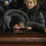 
              Nadia cries over the coffin of her son Oleg Kunynets, a Ukrainian military servicemen who were killed in the east of the country, during his funeral in Lviv, Ukraine, Tuesday, Feb 7, 2023. (AP Photo/Emilio Morenatti)
            