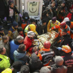 
              Turkish rescue workers carry Eyup Ak, 60, to an ambulance after pulling him out alive from a collapsed building, 104 hours after the earthquake, in Adiyaman, Friday, Feb. 10, 2023. Emergency crews made a series of dramatic rescues in Turkey on Friday, pulling several people, some almost unscathed, from the rubble, four days after a catastrophic earthquake killed more than 20,000. (AP Photo/Emrah Gurel)
            
