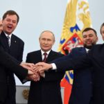 
              From left, Vladimir Saldo, the head of the Kherson region; Yevgeny Balitsky, the head of the Zaporizhzhia region; Russian President Vladimir Putin, center; Denis Pushilin, head of the self-proclaimed Donetsk People's Republic; and Leonid Pasechnik, head of the self-proclaimed Luhansk People's Republic, pose at a ceremony to sign treaties to illegally annex Ukrainian territories at the Kremlin in Moscow, on Friday, Sept. 30, 2022, in a sharp escalation of the war in Ukraine. Putin sent troops into Ukraine on Feb. 24, 2022, and appears determined to prevail. (Grigory Sysoyev, Sputnik, Kremlin Pool Photo via AP, File)
            