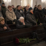 
              People gather at a ceremony for Eduard Strauss, a Ukrainian serviceman who died in combat on Jan. 17 in Bakhmut, during his farewell ceremony in Kyiv, Ukraine, Monday, Feb. 6, 2023. (AP Photo/Daniel Cole)
            