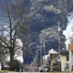 
              A black plume rises over East Palestine, Ohio, as a result of the controlled detonation of a portion of the derailed Norfolk and Southern trains Monday, Feb. 6, 2023. (AP Photo/Gene J. Puskar)
            