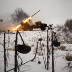 
              FILE - Ukrainian servicemen of the Prince Roman the Great 14th Separate Mechanized Brigade fire a Soviet era Grad multiple rocket launcher at Russian positions in the Kharkiv area, Ukraine, Saturday, Feb. 25, 2023. Grueling artillery battles have stepped up in recent weeks in the vicinity of Kupiansk, a strategic town on the eastern edge of Kharkiv province by the banks of the Oskil River as Russian attacks intensifying in a push to capture the entire industrial heartland known as the Donbas, which includes the Donetsk and the Luhansk provinces. (AP Photo/Vadim Ghirda, File)
            