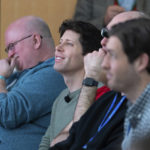 
              OpenAI CEO Sam Altman, second from left, watches a presentation introducing the integration of the Microsoft Bing search engine and Edge browser with OpenAI on Tuesday, Feb. 7, 2023, in Redmond, Wash.  Microsoft is fusing ChatGPT-like technology into its search engine Bing, transforming an internet service that now trails far behind Google into a new way of communicating with artificial intelligence. (AP Photo/Stephen Brashear)
            