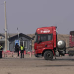 
              A truck is stopped at a checkpoint along a road in Qingtongxia on northern China's Ningxia Hui Autonomous Region leading to the site of a collapsed open pit mine in Alxa League in northern China's Inner Mongolia Autonomous Region, Friday, Feb. 24, 2023. Rescuers have changed their approach to search for dozens of people missing from a coal mine collapse in northern China to avoid further landslides, state broadcaster CCTV reported Friday. (AP Photo/Ng Han Guan)
            