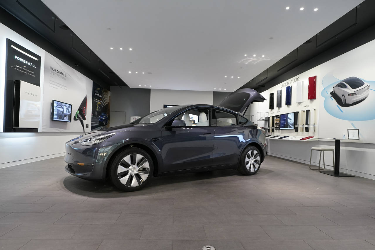 FILE - A Tesla Model Y Long Range is displayed on Feb. 24, 2021, at the Tesla Gallery in Troy, Mich...
