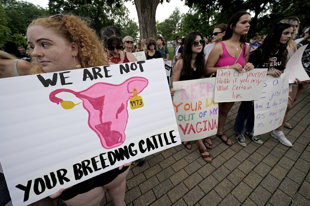FILE - Abortion-rights advocates gather outside a the Kansas Statehouse to protest the U.S. Supreme...