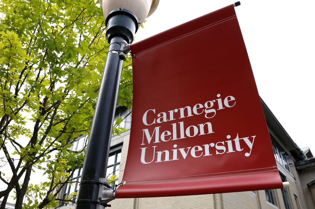 FILE - A Carnegie Mellon University sign is displayed outside Baker Hall on the university's campus...