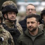 
              FILE - Ukrainian President Volodymyr Zelenskyy poses for a photo with soldiers after attending a flag-raising ceremony in the recaptured city of Izium, Ukraine, on Sept. 14, 2022. Zelenskyy has ruled out any talks with Russia until it withdraws all of its forces from Ukrainian territory, including Crimea. (AP Photo/Leo Correa, File)
            