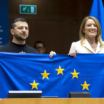 
              In this photo provided by the European Parliament, Ukraine's President Volodymyr Zelenskyy, left, and European Parliament President Roberta Metsola hold up a European Union flag during a plenary session at the European Parliment in Brussels, Thursday, Feb. 9, 2023.  Zelenskyy says that “a Ukraine that is winning” should become a European Union member. Zelenskky made his comments during an address on Thursday to the European Parliament on a rare trip outside Ukraine which has been trying to repel a full-scale invasion by Russia for nearly a year. (Daina Le Lardice, European Parliament via AP)
            