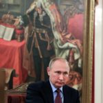 
              Russian President Vladimir Putin meets with Japanese Foreign Minister Fumio Kishida with a painting depicting Russian Czar Peter the Great in the background, in St. Petersburg, Russia, on Friday, Dec. 2, 2016. Putin sent Russian troops into Ukraine on Feb. 24, 2022, and appears determined to prevail -- ruthlessly and at all costs. (Mikhail Klimentyev/Sputnik, Kremlin Pool Photo via AP, File)
            