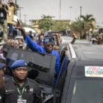 
              Presidential candidate Bola Tinubu of the All Progressives Congress gestures to supporters after casting his vote in the presidential elections in Lagos, Nigeria, Saturday, Feb. 25, 2023. Voters in Africa's most populous nation are heading to the polls Saturday to choose a new president, following the second and final term of incumbent Muhammadu Buhari. (AP Photo/Ben Curtis)
            