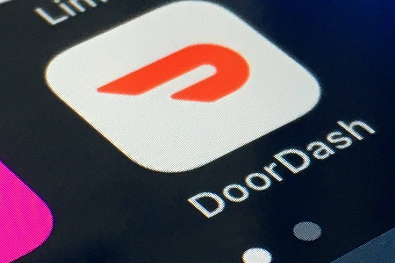 FILE - The DoorDash app is shown on a smartphone on Feb. 27, 2020, in New York. DoorDash said Thurs...