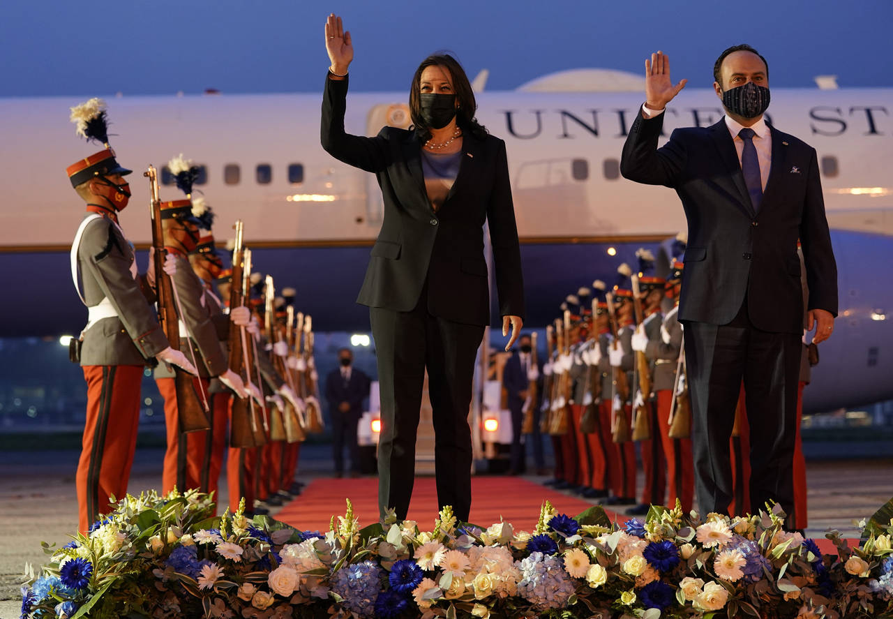 FILE - Vice President Kamala Harris and Guatemala's Minister of Foreign Affairs Pedro Brolo wave at...