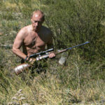 
              In this photo released on Saturday, Oct. 30, 2010, then-Russian Prime Minister Vladimir Putin carries a hunting rifle during his trip in Ubsunur Hollow in the Siberian region of Tuva, on the border with Mongolia. Putin sent Russian forces into Ukraine on Feb. 24, 2022, and appears determined to prevail -- ruthlessly and at all costs. (Dmitry Astakhov, Sputnik, Government Pool Photo via AP, File)
            