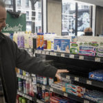
              Dominick Albrego, director of security for Gristedes and D'Agostino supermarkets and former police officer, checks a shelf in the health and beauty section for missing products "swept up" in a suspected theft, Tuesday Jan. 31, 2023, in New York. The section was moved closer to the front of the store to curtail theft. (AP Photo/Bebeto Matthews)
            