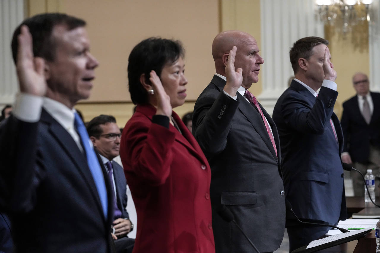 From left are Scott Paul, president of the Alliance for American Manufacturing, Tong Yi, a human ri...