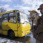 
              Kostyantyn holds his fox Ksiuha while they wait for a bus in Kyiv, Ukraine, Tuesday, Feb. 7, 2023. (AP Photo/Evgeniy Maloletka)
            
