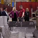 
              Secretary of the Army Christine Wormuth is shown the Stryker vehicle platform during a tour of the Joint Systems Manufacturing Center, Thursday, Feb. 16, 2023, in Lima, Ohio. (AP Photo/Carlos Osorio)
            