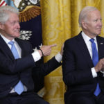
              Former President Bill Clinton points to President Joe Biden as they listen to Vice President Kamala Harris speak in the East Room of the White House in Washington, Thursday, Feb. 2, 2023, at an event to mark the 30th Anniversary of the Family and Medical Leave Act. (AP Photo/Susan Walsh)
            