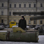 
              A man looks at the remains of a Russian missile displayed in central Kyiv, Ukraine, Tuesday, Feb. 7, 2023. (AP Photo/Daniel Cole)
            