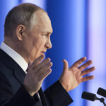 
              Russian President Vladimir Putin gestures as he gives his annual state of the nation address in Moscow, Russia, Tuesday, Feb. 21, 2023. (Mikhail Metzel, Sputnik, Kremlin Pool Photo via AP)
            