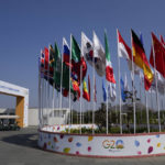 
              A buggy moves past a display of flags of participating countries at the venue of G-20 financial conclave on the outskirts of Bengaluru, India, Wednesday, Feb. 22, 2023. Top financial leaders from the Group of 20 leading economies are gathering in the south Indian technology hub of Bengaluru to tackle challenges to global growth and stability. India is hosting the conclave for the first time in 20 years. (AP Photo/Aijaz Rahi)
            