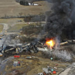 
              This photo taken with a drone shows portions of a Norfolk Southern freight train that derailed Friday night in East Palestine, Ohio are still on fire at mid-day Saturday, Feb. 4, 2023. (AP Photo/Gene J. Puskar)
            