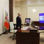 
              Russian President Vladimir Putin listens to the national anthem at a ceremony for the nuclear-powered icebreaker Ural and the launching of the icebreaker Yakutia, via videoconference, at his Novo-Ogaryovo state residence, outside Moscow, Tuesday, Nov. 22, 2022. Putin sent Russian forces into Ukraine on Feb. 24, 2022, and appears determined to prevail. (Mikhail Metzel/Pool Photo via AP, File)
            