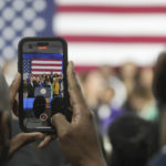 
              A man takes video as Vice President Kamala Harris gives remarks on broadband internet expansion on Monday, Feb. 27, 2023, at Benedict College in Columbia, S.C. (AP Photo/Meg Kinnard)
            