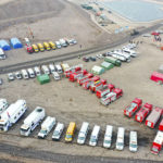 
              In this aerial photo released by China's Xinhua News Agency, rescue vehicles are parked near the site of a collapsed open pit coal mine in Alxa League in northern China's Inner Mongolia Autonomous Region, Thursday, Feb. 23, 2023. An open pit mine collapsed in China's northern Inner Mongolia region on Wednesday, killing multiple people and leaving dozens more missing, state media reported. (Lian Zhen/Xinhua via AP)
            
