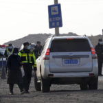 
              A truck is stopped at a checkpoint leading to the site of a collapsed open pit mine in Alxa League in northern China's Inner Mongolia Autonomous Region, Thursday, Feb. 23, 2023. An open pit mine collapsed in China's northern Inner Mongolia region on Wednesday, killing multiple people and leaving dozens more missing, state media reported. (AP Photo/Ng Han Guan)
            