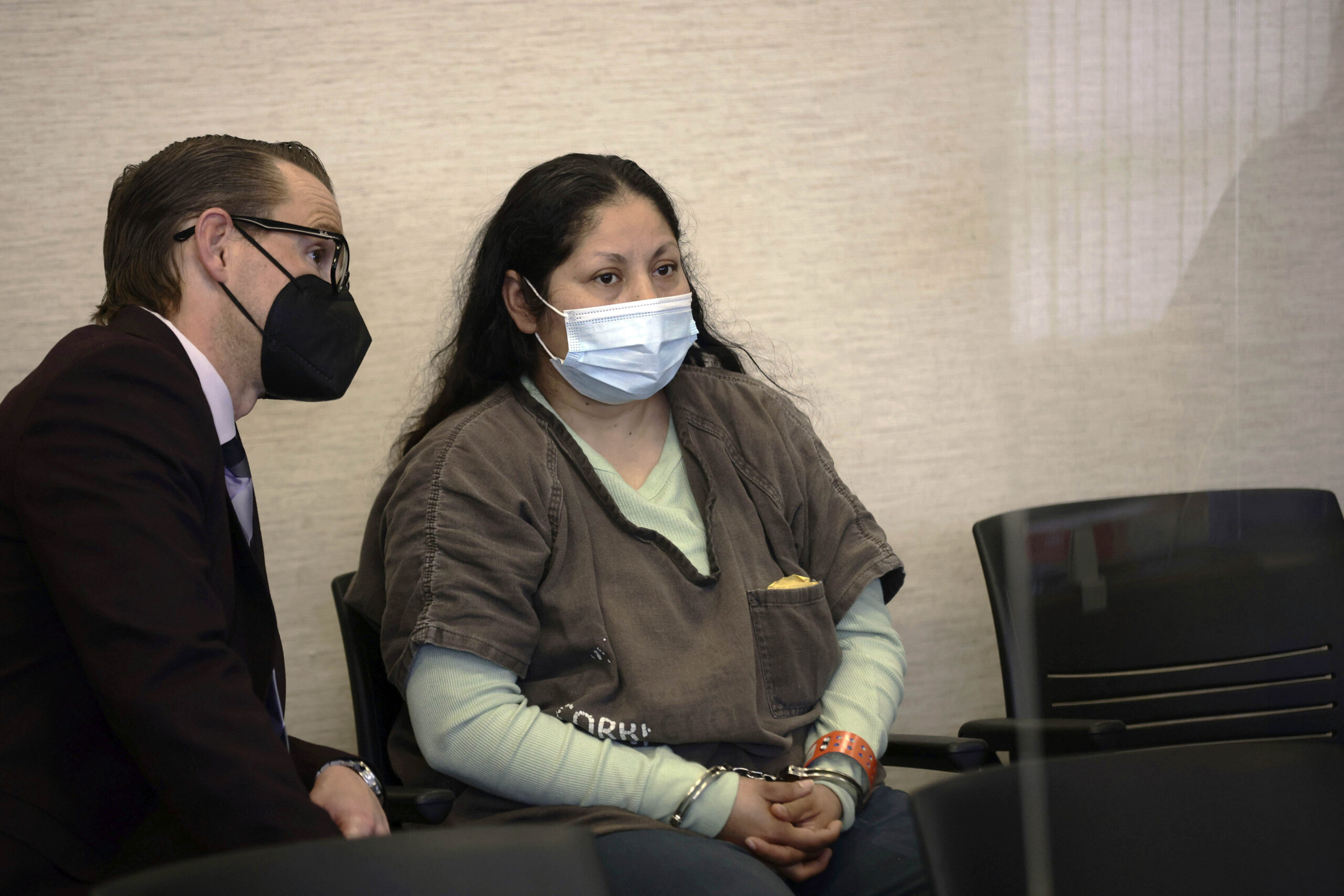 FILE - Yesenia Guadalupe Ramirez, center, one of two suspects charged in connection with the kidnap...