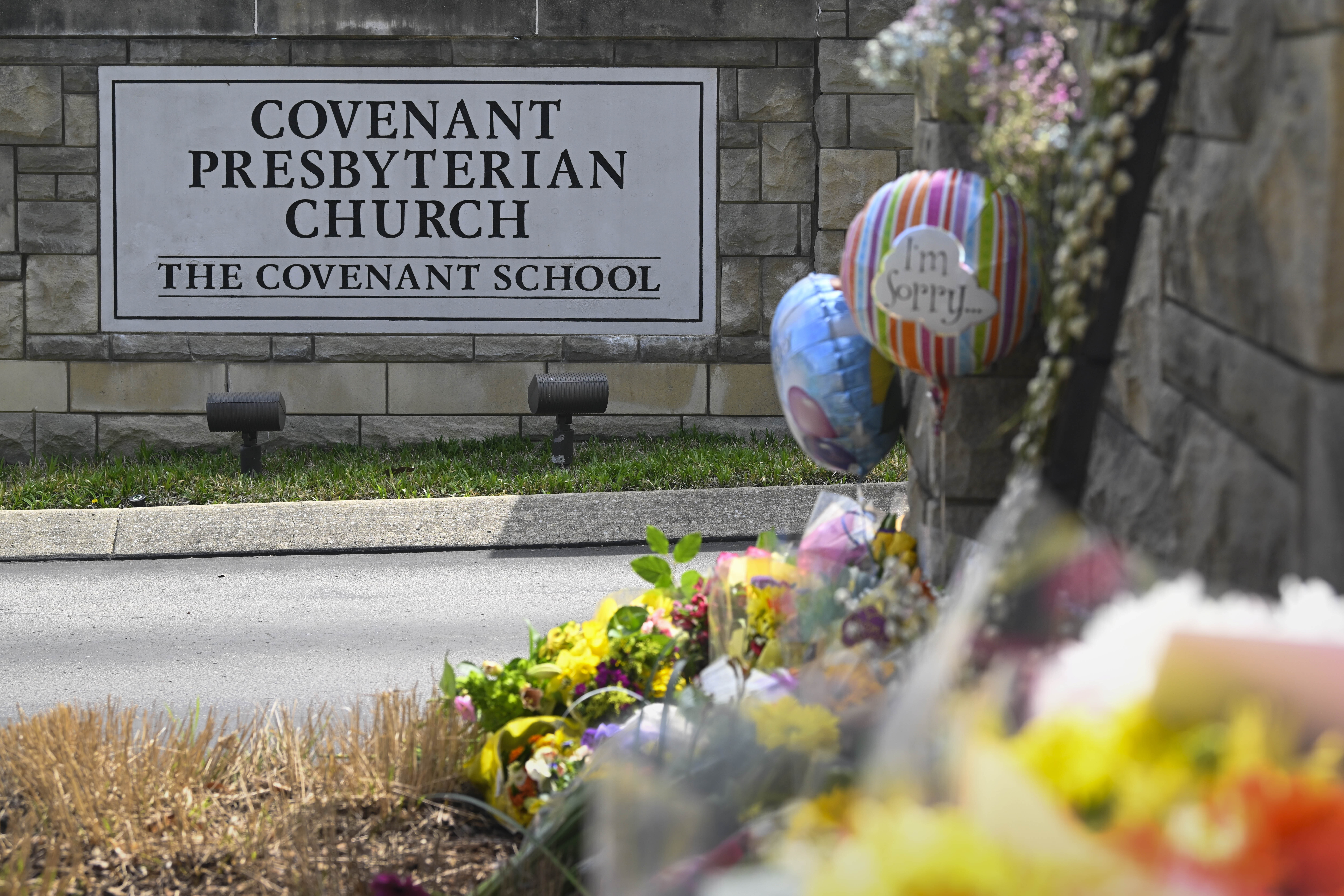 An an entry to Covenant School has become a memorial for shooting victims, Tuesday, March 28, 2023,...