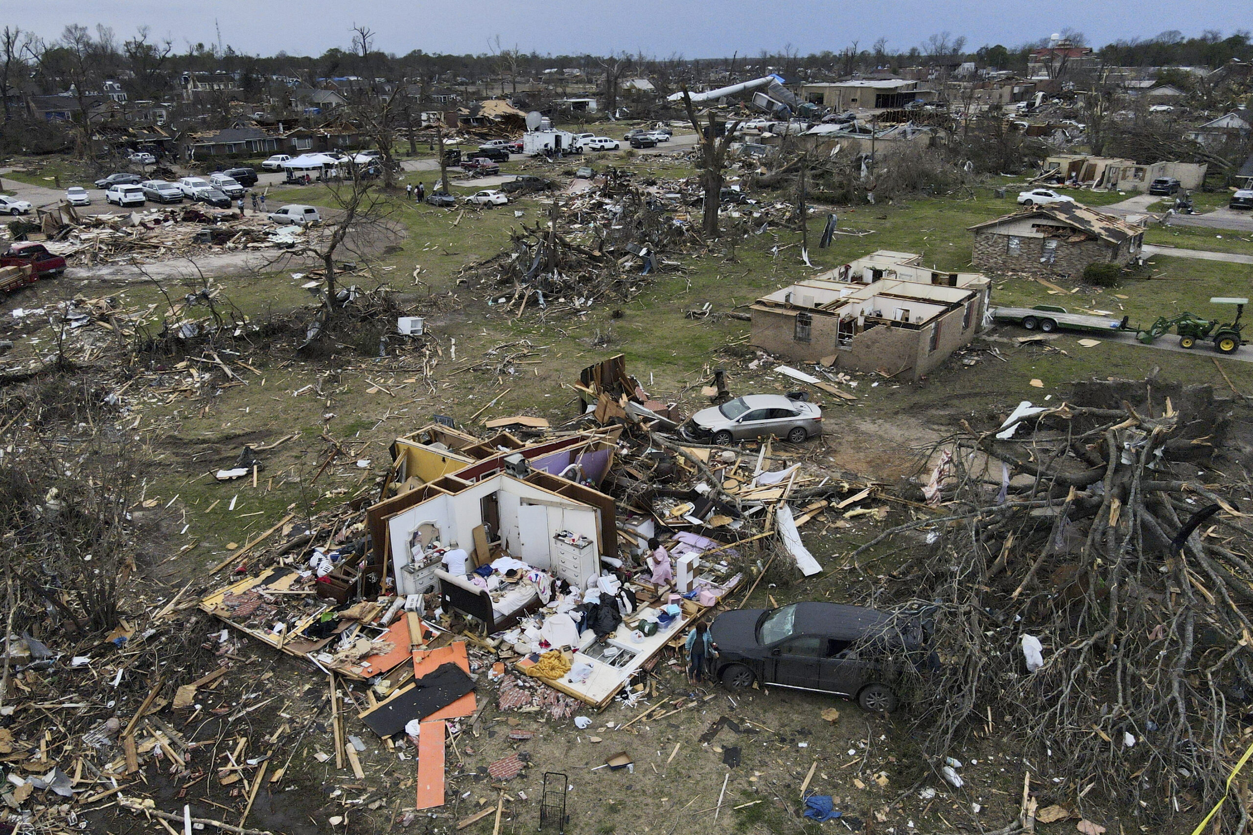 FILE - Debris is strewn about tornado damaged homes, Sunday, March 26, 2023, in Rolling Fork, Miss....