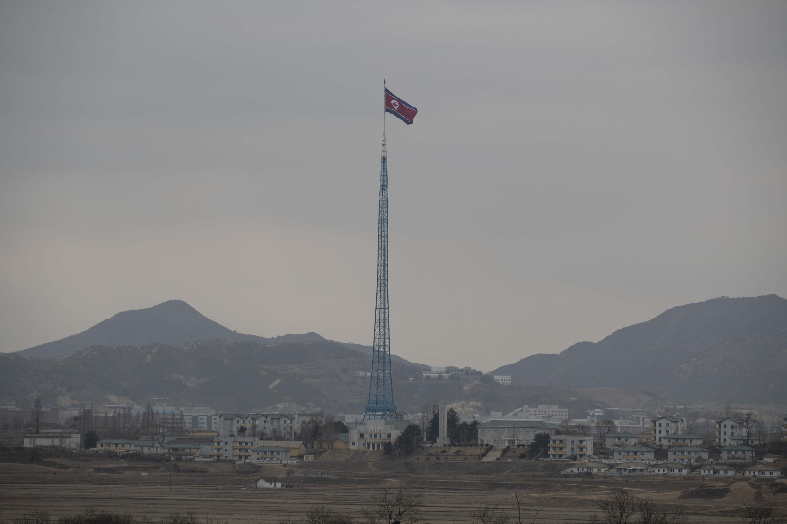 FILE - A North Korean flag flutters in North Korea's village Gijungdong as seen from an South Korea...