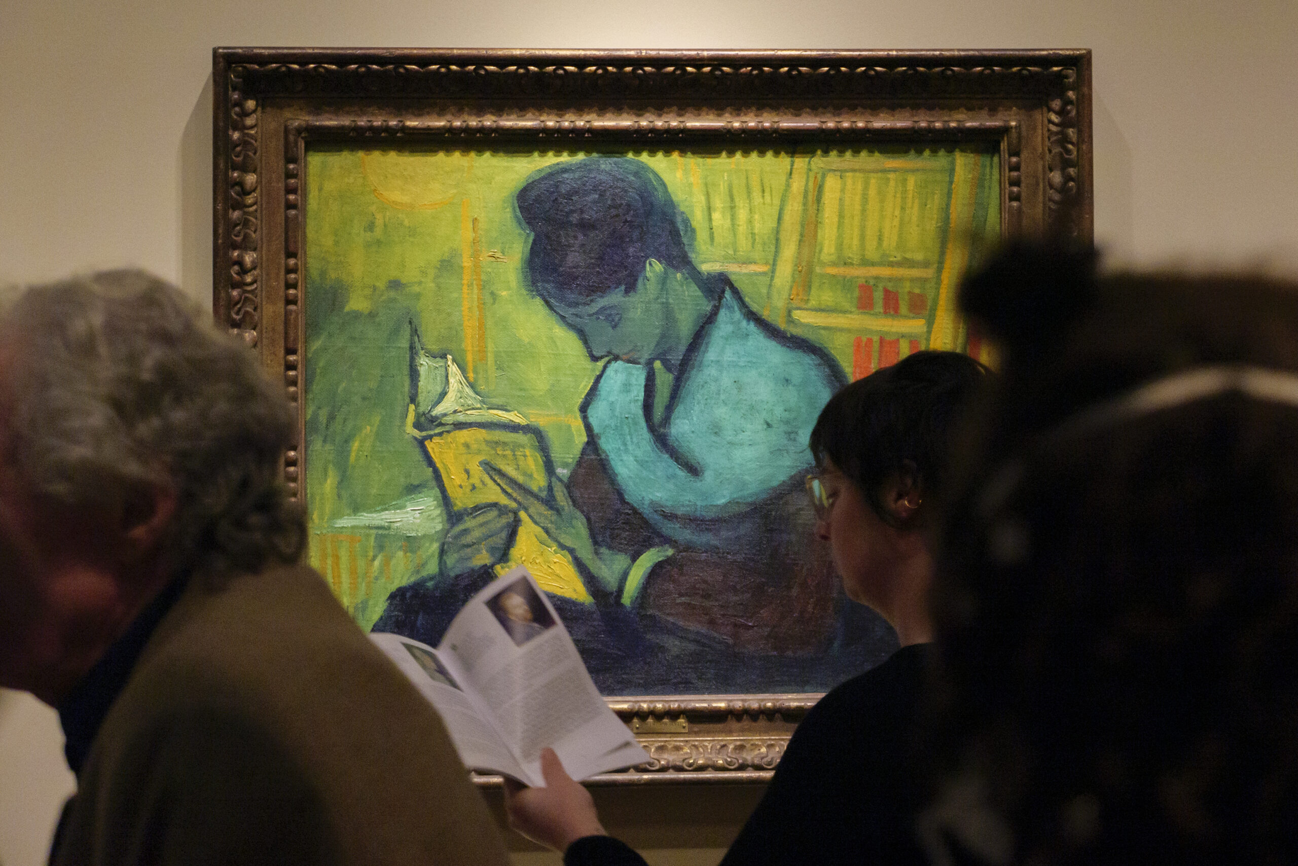 FILE - Visitors file past the Van Gogh painting "Une Liseuse De Romans", also known as "The Novel R...