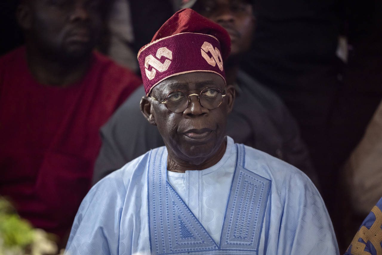 Bola Tinubu, of the All Progressives Congress, meets with supporters at the Party's campaign headqu...