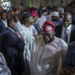 
              President-Elect Bola Tinubu, center, gestures to supporters after receiving his certificate at a ceremony in Abuja, Nigeria Wednesday, March 1, 2023. Election officials declared Tinubu the winner of Nigeria's presidential election Wednesday, keeping the ruling party in power in Africa's most populous nation. (AP Photo/Ben Curtis)
            
