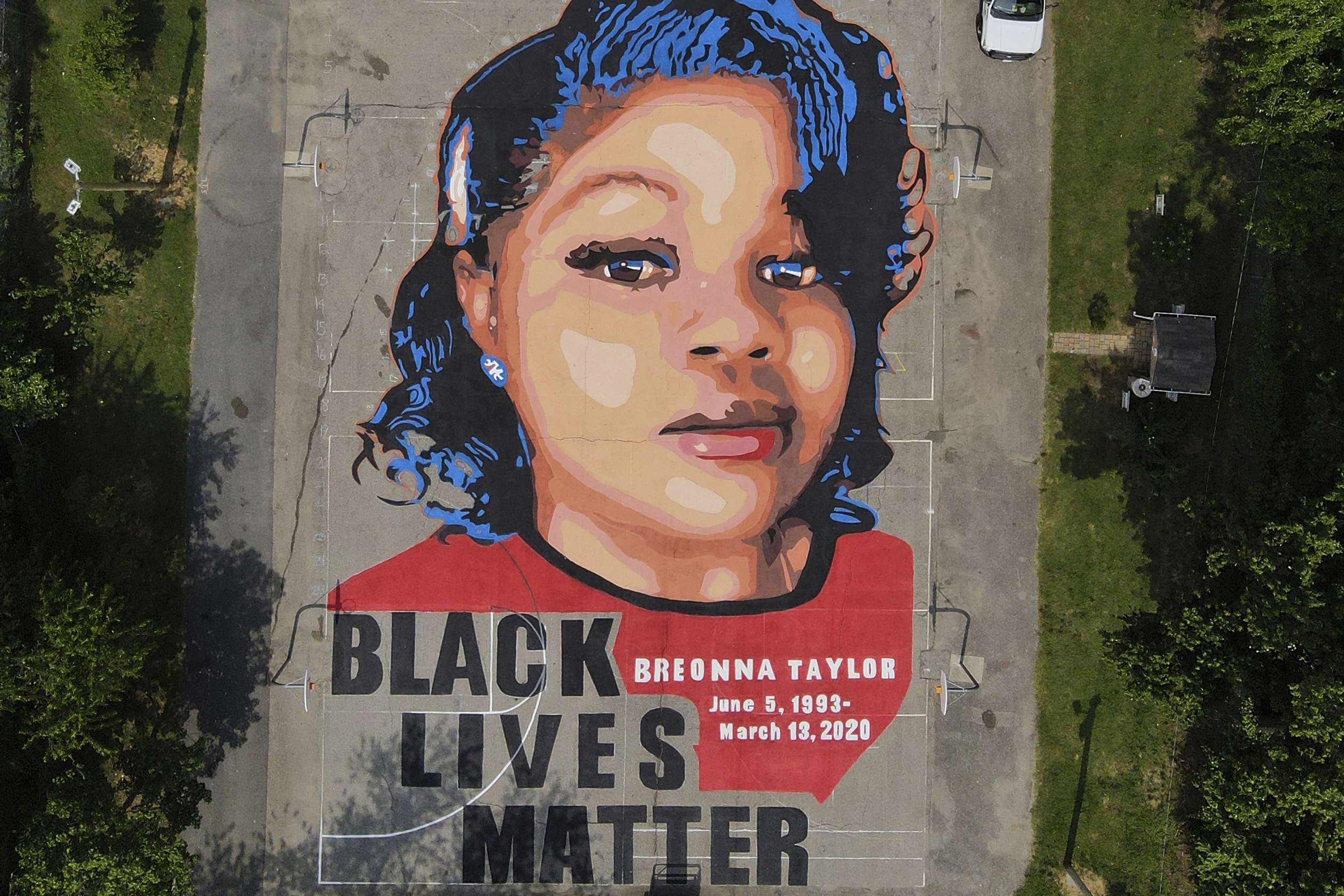 FILE - A ground mural depicting a portrait of Breonna Taylor is seen at Chambers Park in Annapolis,...