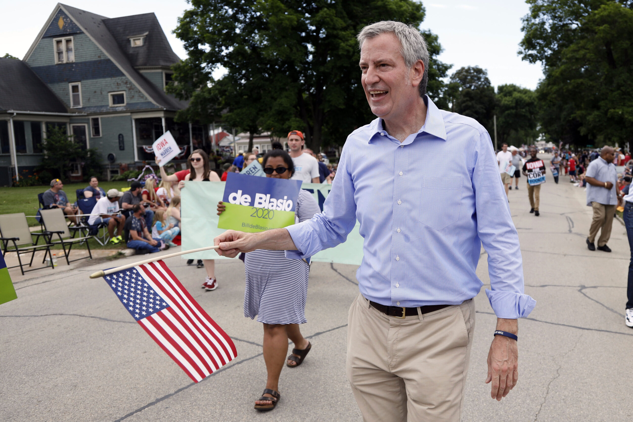 FILE - Democratic presidential candidate New York Mayor Bill de Blasio walks in the Fourth of July ...